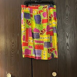 SK & Company silky, wild patterned skirt. Size 10. Fully lined and zipper back.